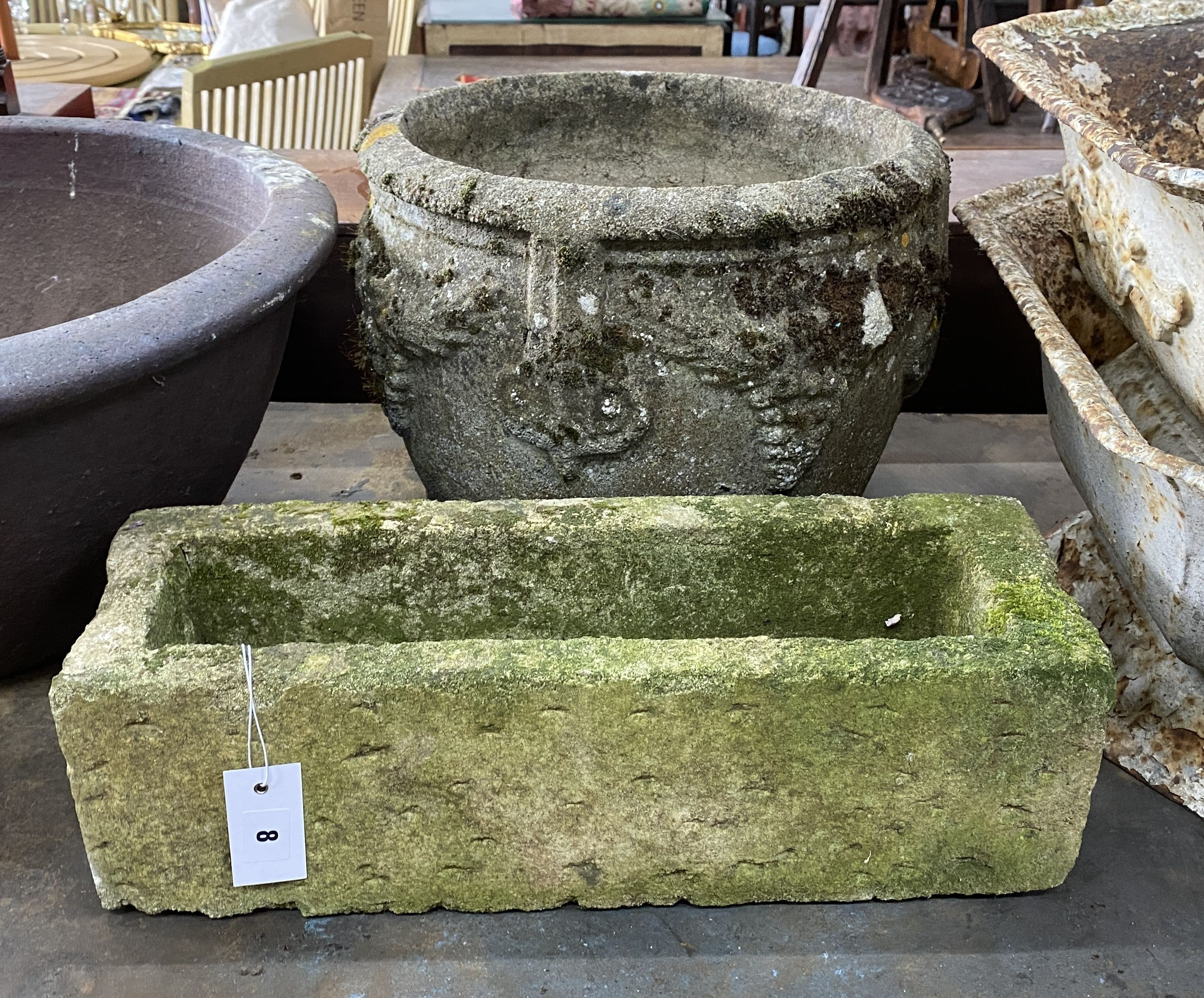 A circular reconstituted stone garden planter, diameter 38cm, height 32cm together with a smaller rectangular planter